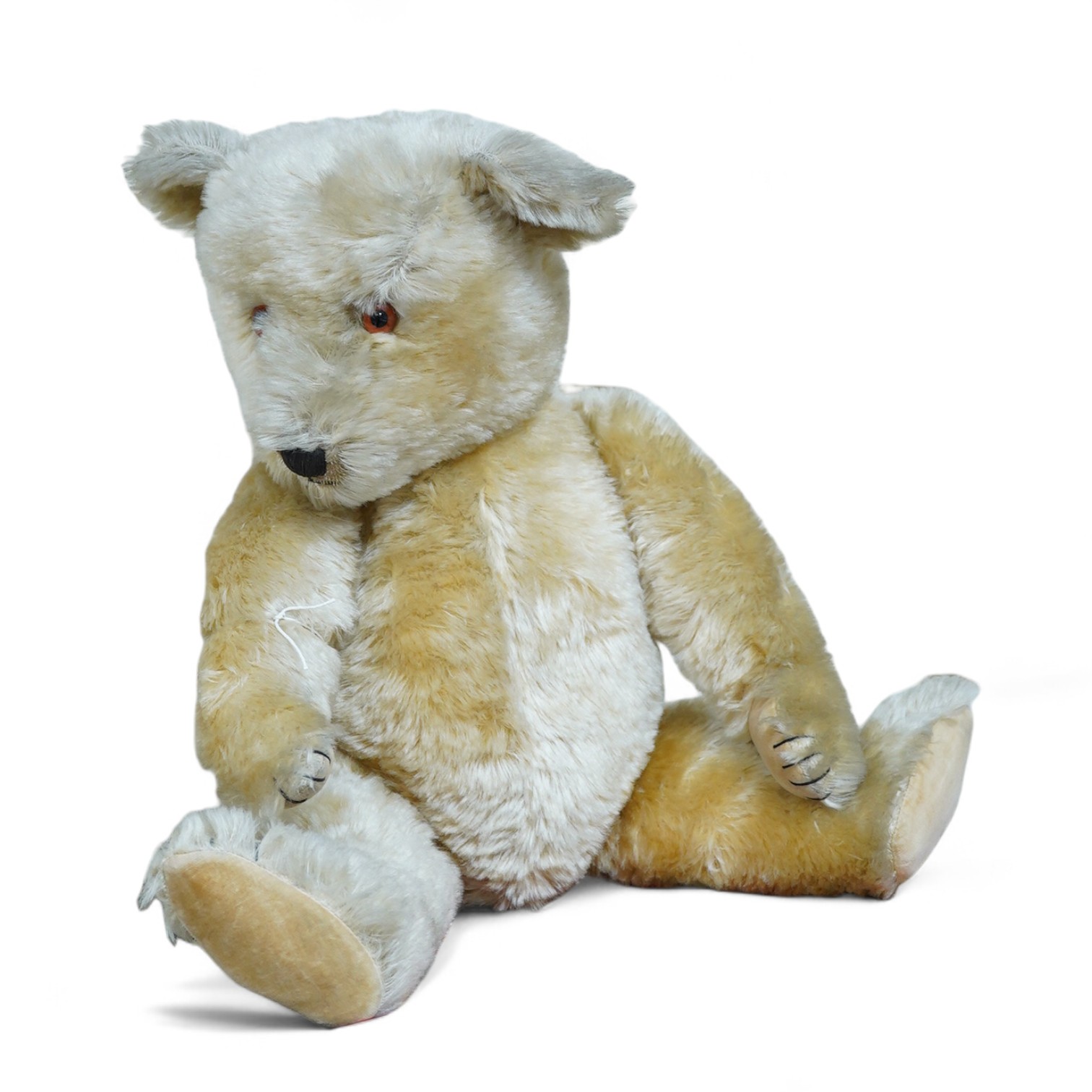 A gold plush mohair teddy bear, perhaps Chad Valley, circa 1950, approx 62cm tall. Condition - fair to good.